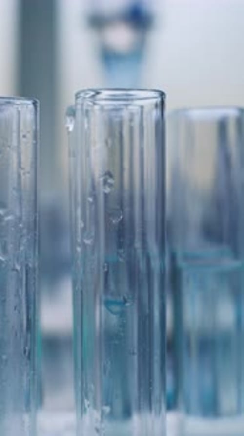 Liquid Being Poured Into Test Tubes in Laboratory
