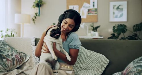 Happy woman, kiss and play with dog in home for love, care or listen to music on headphones