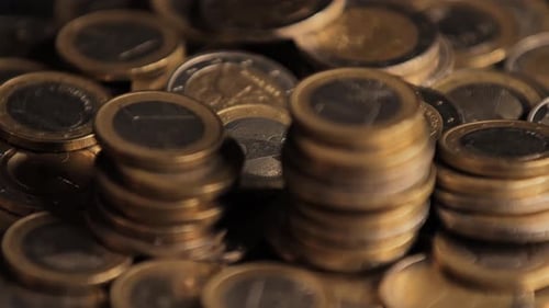 Close-Up of Stacked Euro Coins in Motion, Cinematic Money Shot, Dramatic Light