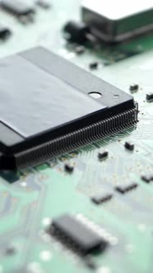 Green Electronic Circuit Board with Processor Chips and Capacitors