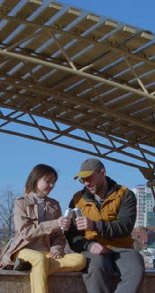 Father's Day Vertical Video of a Father and Daughter Drinking Soda Outdoors