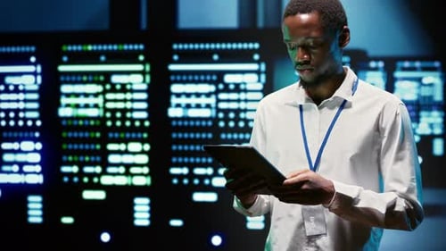 African American Engineer Inspecting High Performance Servers for Scientific Computing with