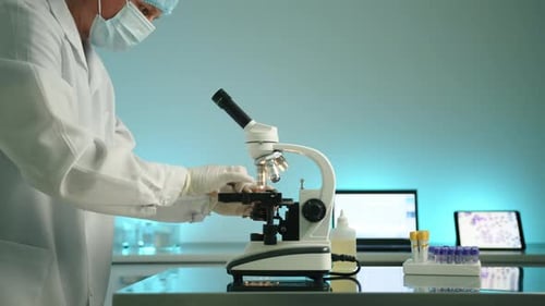 Scientist Using Microscope in Modern Laboratory