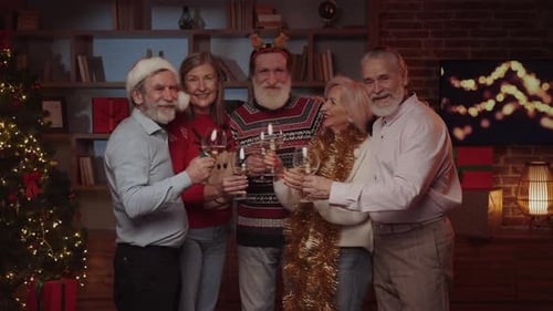 Friends Toast Christmas Holiday in Festive Living Room