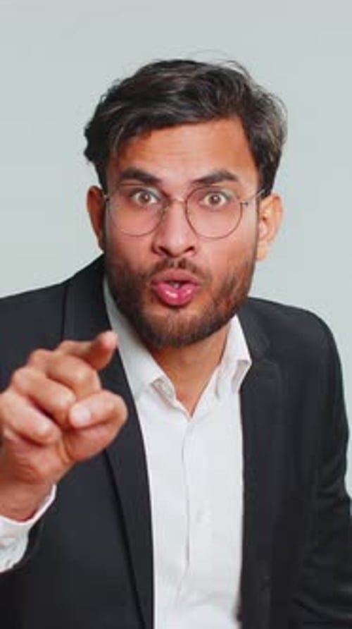 Upset Man Points and Scolds in Studio