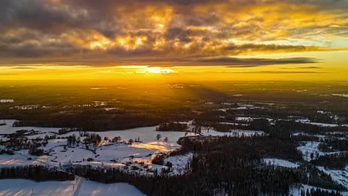 Scenic Sunrise Over Snow Covered Trees