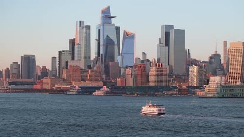 Aerial view of a ferry on The Hudson River at sunset