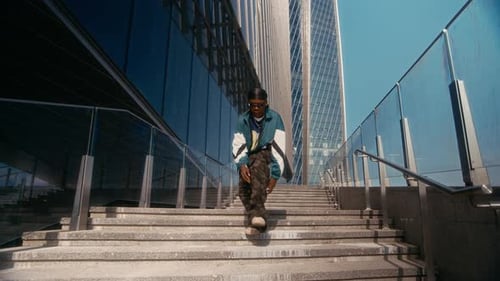 Stylish Young Adult Dancing on Concrete Steps