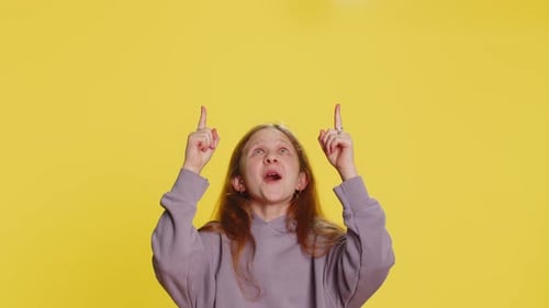 Girl Child Pointing Empty Place Advertising Area for Commercial Text Copy Space for Goods Promotion