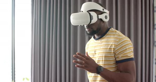 Man Using Virtual Reality Headset in Home