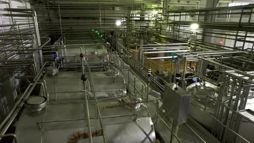 Service Ground Near Huge Tanks with Chemicals at Plant