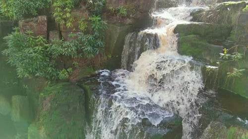 Aerial drone footage of a tall rocky waterfall in the Yorkshire Dales, Pennies. Moorland scene of a