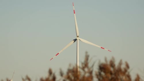 Zooming Into A Wind Turbine During Daytime