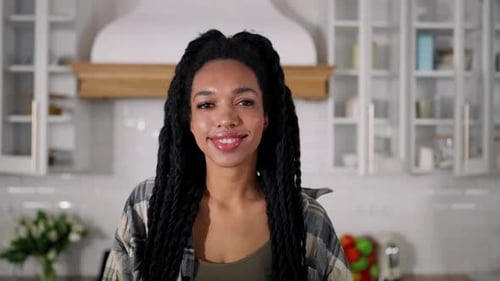 Woman Posing in Kitchen with Fruits and Vegetables