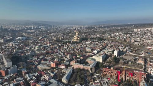 Aerial view of Holy Trinity Cathedral Sameba in Tbilisi Georgia. Winter Sunset drone footage.