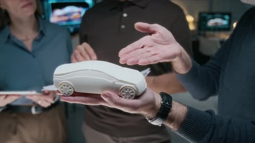Car Designers Analyze 3D Model in Office