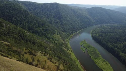 Awesome aerial view of scenic river among evergreen woods