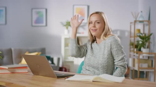Blonde Woman Gesturing and Dancing at Desk
