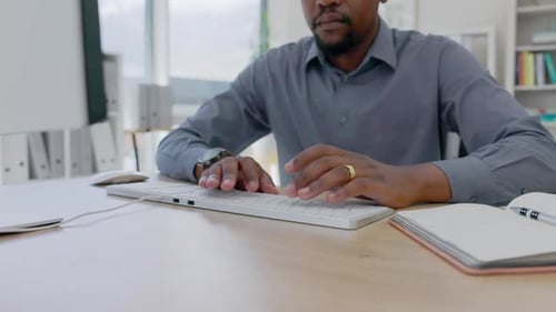 Hands, black man and writing in notebook with computer, business schedule and office administration