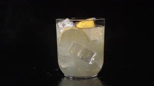 Refreshing Lemon Drink with Ice Close Up Shot
