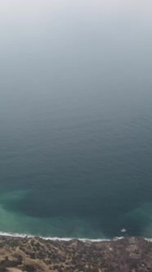 Drone Flies Over Foggy and Fluffy Clouds Aerial Vertical View Blue Sky Sun and Sea Fog Abstract