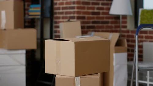 Stacks of Cardboard Boxes in Empty Real Estate Property