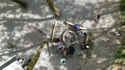 Friends Gather Around a Campfire in Nature