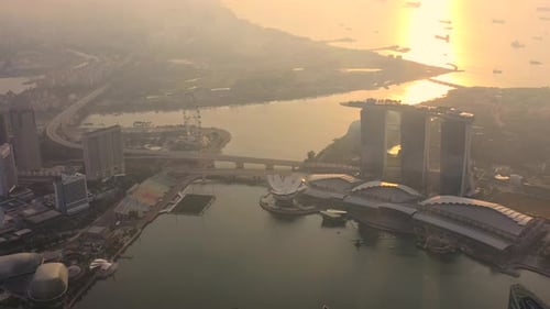 Drone Aerial view 4k Footage of the Marina Bay Sands in Singapore City Skyline. Sunrise
