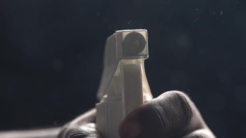 Hand Using White Spray Bottle for Cleaning