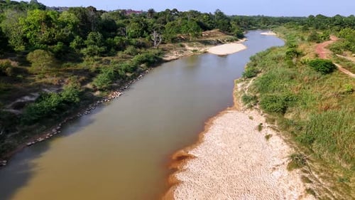 Aerial view shows a winding river through green landscape