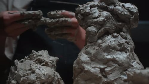 Person Sculpting an Amorphous Clay Sculpture Close Up