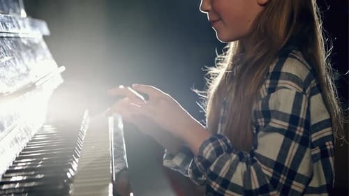 Girl Plays Beautiful Music on Antique Piano Keyboard