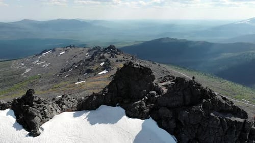 Snowy Peaks And Textured Icy Foreground Dramatic Mountain Terrain Showing Ridges And Icy Textures