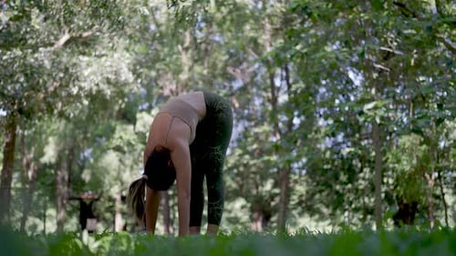 Harmony of garden yoga.Women find peace through poses.