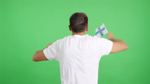 Rear View of a Man Waving a Finnish Pennant