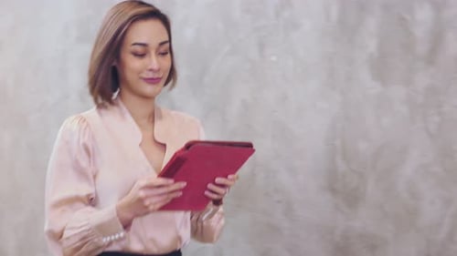 Close Up asian women walking in corridor and use tablet.
