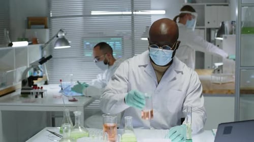 Scientists Working on Experiments in a Laboratory