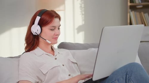 Woman on Laptop Video Call at Home