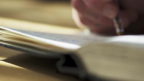 slow motion of hand writing note on notebook paper with ink pen sunshine journaling meditative perso