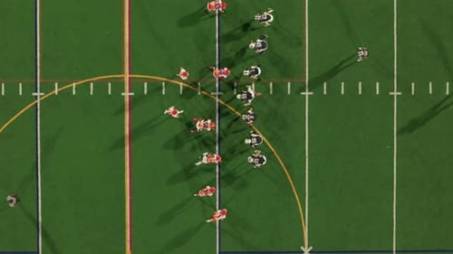 American Football Teams of Play at Night Time Aerial Top Down Shot