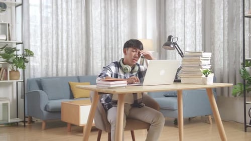 Stressed Asian Teenager Suffer From Headache Bad Vision Sight Problem While Use Laptop At Home