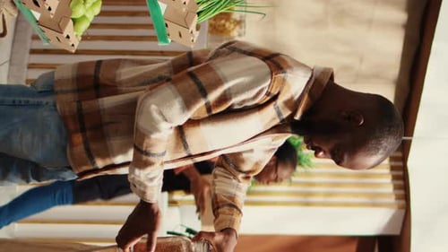 Vertical Video Male Customer Checking Types of Pasta or Grains at Local Market