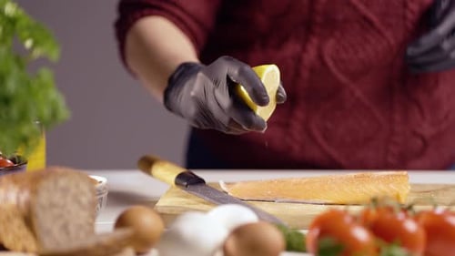 Close-Up of Chef Squeezing Fresh Lemon Juice Over Raw Salmon Fillet – Gourmet Seafood Cooking in 4K