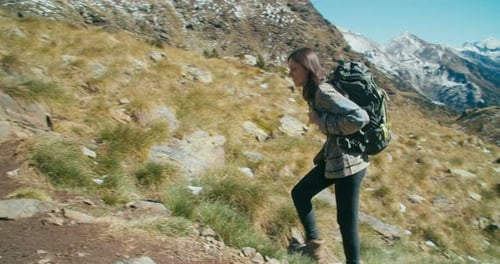 Woman on Vacation Travel Adventure Climb Mountain with Hiker Backpack on Trail