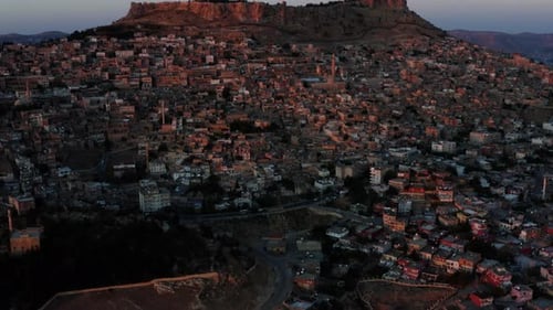 Panoramic View Of Historical Mardin City At Sunset In Turkey - aerial drone shot