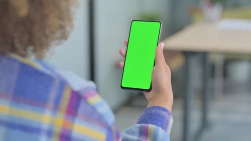 Close Up of Young African Woman Using Phone with Green Screen
