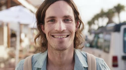 Smile, holiday and face of man in city for travel, getaway or weekend trip in summer with relax