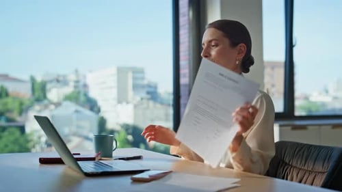 Woman Video Conferencing in an Office