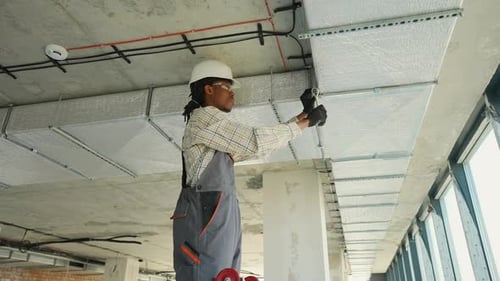Electrician Installing Cables and Wires in a Building
