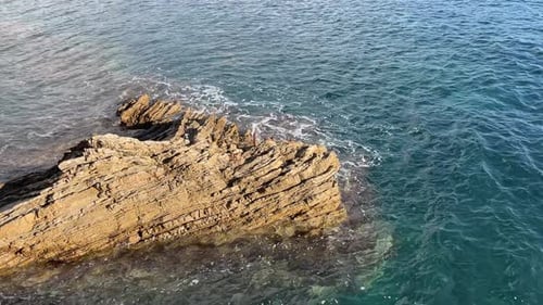 Incredibly Clear Sea Water Washes Over Beautiful Cliffs and an Iddylic Seascape